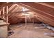Unfinished attic space featuring exposed beams, plywood flooring, and ventilation ducts at 31 Berkshire Hall, Kiawah Island, SC 29455