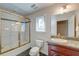 Full bathroom with a shower-tub combo, decorative tile, granite countertop vanity, and a large mirror at 31 Berkshire Hall, Kiawah Island, SC 29455