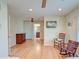 Bright bedroom boasts hardwood floors, rocking chairs, and an ensuite bathroom at 31 Berkshire Hall, Kiawah Island, SC 29455