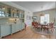 Cozy dining area with glass table, casual seating, and built-in display cabinets at 31 Berkshire Hall, Kiawah Island, SC 29455