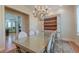 Bright dining room features a large window offering views, a chandelier, and a decorative china cabinet with storage at 31 Berkshire Hall, Kiawah Island, SC 29455