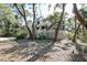 Large two-story home with a white exterior, covered porch and a two-car garage at 31 Berkshire Hall, Kiawah Island, SC 29455