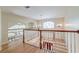 Upstairs foyer featuring wood railings and floors, with lots of natural light at 31 Berkshire Hall, Kiawah Island, SC 29455