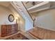 Grand foyer with a staircase, decorative chest, and an elegant chandelier on the second floor at 31 Berkshire Hall, Kiawah Island, SC 29455