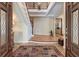 Spacious foyer features a staircase, hardwood floors, decorative rug and arched doorway at 31 Berkshire Hall, Kiawah Island, SC 29455