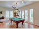 Game room with pool table and light fixture and access to balcony at 31 Berkshire Hall, Kiawah Island, SC 29455