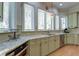 Well-lit kitchen with granite countertops, stainless steel appliances, and ample cabinet space at 31 Berkshire Hall, Kiawah Island, SC 29455