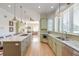 Spacious kitchen with a long island, granite countertops, and stainless steel appliances at 31 Berkshire Hall, Kiawah Island, SC 29455