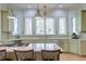 Bright kitchen features granite countertops, tile backsplash, stainless appliances and large central island with barstool seating at 31 Berkshire Hall, Kiawah Island, SC 29455