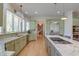 Bright kitchen with stainless appliances and granite counters with long island at 31 Berkshire Hall, Kiawah Island, SC 29455