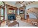 Elegant living room showcasing built-in cabinetry, a fireplace, and seamless flow to the foyer at 31 Berkshire Hall, Kiawah Island, SC 29455