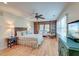 Stylish main bedroom showcasing hardwood floors, built-in shelving, and designer furniture at 31 Berkshire Hall, Kiawah Island, SC 29455