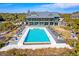 Expansive pool with lounge chairs and umbrellas offers an inviting outdoor oasis for relaxation and recreation at 31 Berkshire Hall, Kiawah Island, SC 29455