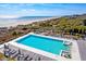 Beautiful pool area overlooking the ocean and beach, with plenty of lounge chairs for relaxing and enjoying the view at 31 Berkshire Hall, Kiawah Island, SC 29455