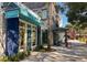 Charming retail storefront with covered walkways and a sidewalk featuring an American flag at 31 Berkshire Hall, Kiawah Island, SC 29455