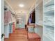 Spacious walk-in closet with custom shelving, rods, and ample storage space at 31 Berkshire Hall, Kiawah Island, SC 29455