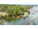 An aerial view of a wooden pier on the water surrounded by green trees and foliage at 3699 Goodwater St, Mount Pleasant, SC 29466
