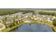 Aerial view of a neighborhood pool and lake surrounded by community homes at 3699 Goodwater St, Mount Pleasant, SC 29466