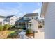 Spacious backyard with a screened-in porch, landscaped garden, and well-maintained lawn, ideal for outdoor gatherings at 3699 Goodwater St, Mount Pleasant, SC 29466