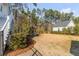 A sprawling backyard complete with a wooden playset, offering a serene space with lush greenery at 3699 Goodwater St, Mount Pleasant, SC 29466