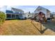 Spacious backyard featuring a playset and lush green grass, perfect for outdoor activities and Gathering fun at 3699 Goodwater St, Mount Pleasant, SC 29466
