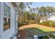 Large backyard featuring a playset, garden, and a lush lawn, ideal for Gathering entertainment and outdoor enjoyment at 3699 Goodwater St, Mount Pleasant, SC 29466