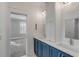 Bathroom featuring a dual sink vanity with modern fixtures and a blue cabinet at 3699 Goodwater St, Mount Pleasant, SC 29466