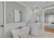 Elegant bathroom with a standalone tub, a glass-enclosed shower, and white subway tile at 3699 Goodwater St, Mount Pleasant, SC 29466