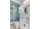 Beautiful bathroom with white vanity and blue-tiled walk-in shower featuring a glass door at 3699 Goodwater St, Mount Pleasant, SC 29466