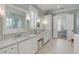 Elegant bathroom featuring double sinks, marble countertops, and a makeup vanity at 3699 Goodwater St, Mount Pleasant, SC 29466