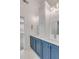 Modern bathroom featuring dual sinks with modern fixtures and a blue cabinet at 3699 Goodwater St, Mount Pleasant, SC 29466