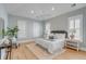 Relaxing bedroom with three windows, a ceiling fan, and a comfortable bed with matching side tables at 3699 Goodwater St, Mount Pleasant, SC 29466