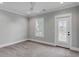 Inviting carpeted bedroom with a ceiling fan, and a door leading to a balcony at 3699 Goodwater St, Mount Pleasant, SC 29466