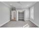 Bedroom featuring grey walls, carpet, a ceiling fan, and a closet with open doors and a shuttered window at 3699 Goodwater St, Mount Pleasant, SC 29466