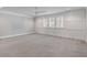 Bright, spacious bedroom with wainscoting, a ceiling fan, and expansive windows with shutter blinds at 3699 Goodwater St, Mount Pleasant, SC 29466