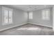 Bedroom featuring grey walls, carpet, a ceiling fan, and windows with shuttered blinds at 3699 Goodwater St, Mount Pleasant, SC 29466