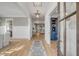 Bright foyer with hardwood floors, stylish rug, and view of the open-concept living spaces at 3699 Goodwater St, Mount Pleasant, SC 29466