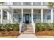 Welcoming front entrance with a brick stairway, white railing, and beautiful landscaping, offering great curb appeal at 3699 Goodwater St, Mount Pleasant, SC 29466