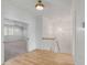 Bright hallway featuring hardwood floors, shiplap walls, and modern lighting fixtures at 3699 Goodwater St, Mount Pleasant, SC 29466