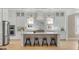 Bright, modern kitchen featuring a large center island, marble backsplash, and stainless steel appliances at 3699 Goodwater St, Mount Pleasant, SC 29466