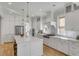 Well-lit kitchen boasts an expansive island, stainless appliances, and elegant pendant lighting at 3699 Goodwater St, Mount Pleasant, SC 29466