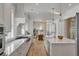 Bright kitchen featuring an island with a sink, stainless appliances, and an open view to the dining area at 3699 Goodwater St, Mount Pleasant, SC 29466