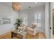 Cozy office with a jute rug, neutral furniture, and decorative lighting under a neutral palette at 3699 Goodwater St, Mount Pleasant, SC 29466