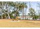 Picnic table on well-maintained lawn overlooking the waterway and marsh at 3699 Goodwater St, Mount Pleasant, SC 29466
