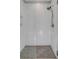 Modern walk-in shower featuring white subway tile walls and pebble stone floor at 3699 Goodwater St, Mount Pleasant, SC 29466