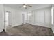 This spacious bedroom features a ceiling fan, ample closet space, a vanity area, and an inviting open doorway at 4722 Whitwil Blvd, North Charleston, SC 29418