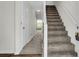 Bright entryway featuring a carpeted staircase and a view to the fenced backyard at 4722 Whitwil Blvd, North Charleston, SC 29418