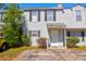 Charming townhouse with light gray siding, dark shutters, and a well-maintained front yard at 4722 Whitwil Blvd, North Charleston, SC 29418