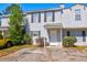 Inviting townhouse with light gray siding, dark shutters, and a well-maintained front yard at 4722 Whitwil Blvd, North Charleston, SC 29418