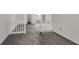 The open living room with neutral carpet provides access to the backyard at 4722 Whitwil Blvd, North Charleston, SC 29418